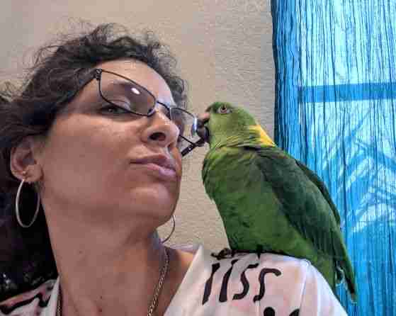 Kalyn with a parrot companion